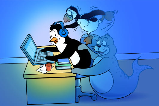 a penguin attempts to work while surrounded by distractions