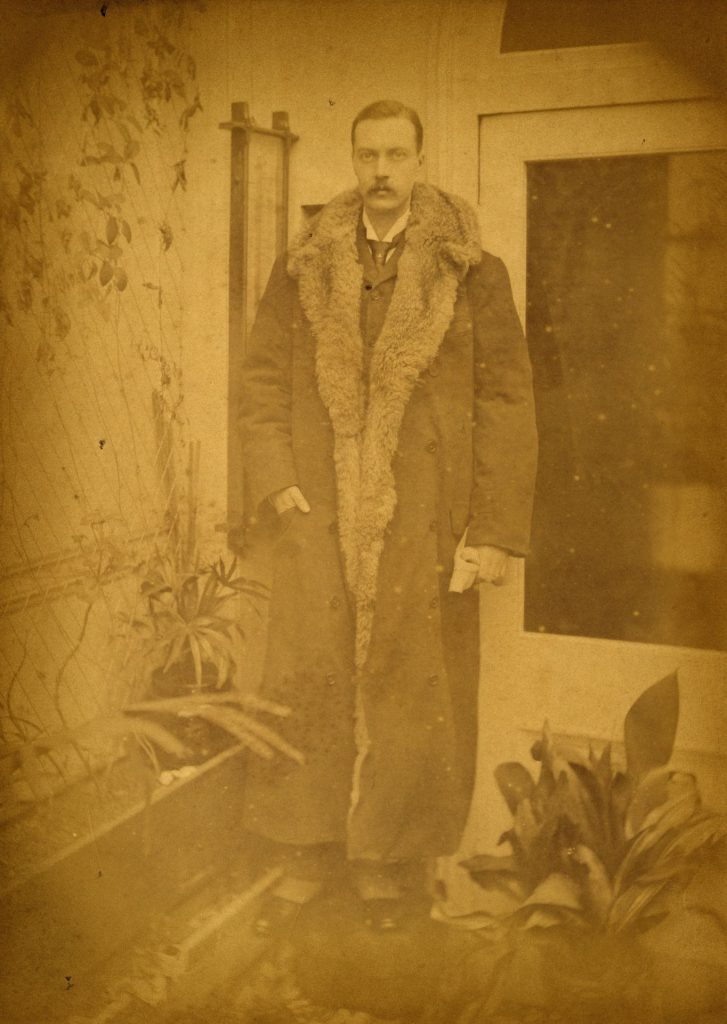 Photograph of man in fur coat